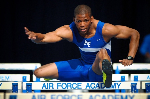 An athlete jumping hurdles